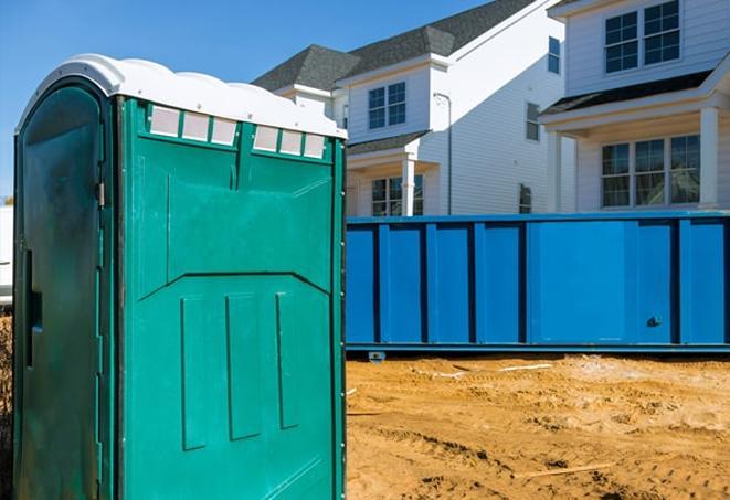 a porta potty lineup at an active job site